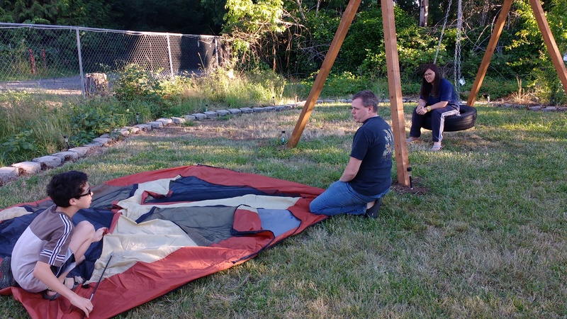 Setting up tents for the family reunion. Mikey, Joseph, Jean.