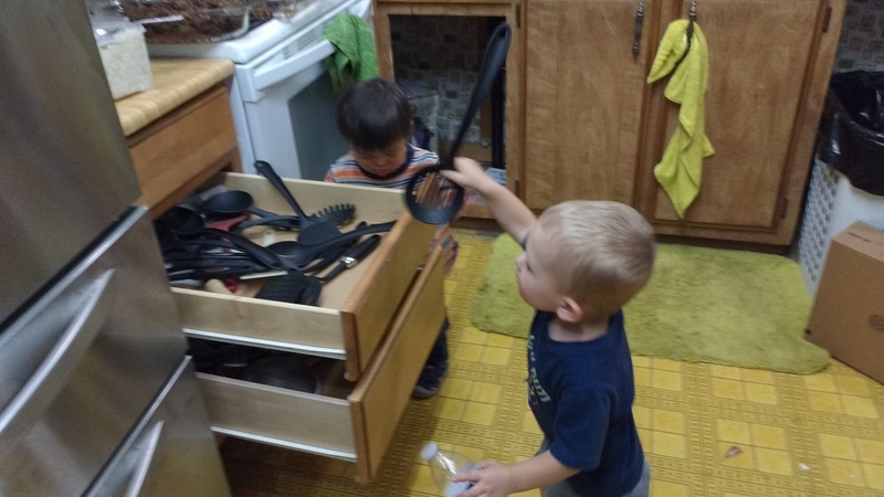 Austin and Calvin explore the kitchen.