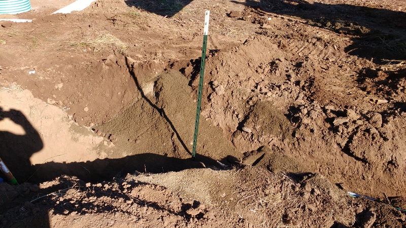 Y in the sewer line near the new 3000 gallon septic tank is marked by the 5.5 foot T post.