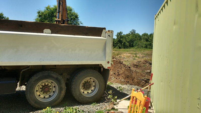 Ready to dump rock into the old septic tank.