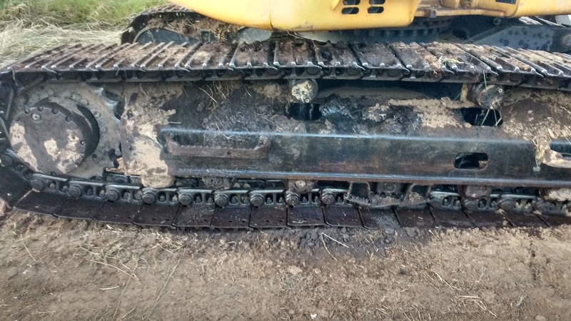 The large excavator blew a hydraulic hose. You can see hydraulic fluid on the treads.