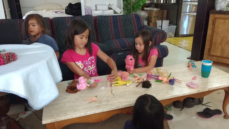 Grandchildren playing with Grandma's Strawberry shortcake dolls and ponies.