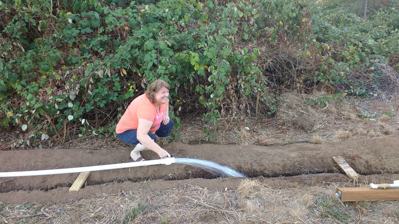 Lois demonstrates the water pressure we are still able to get hundreds of feet from the well.