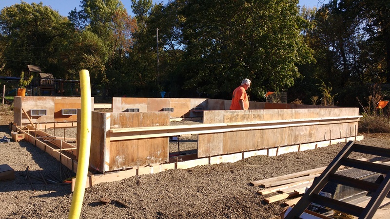 Don looking at the first layer of foundation for the garage/greenhouse.