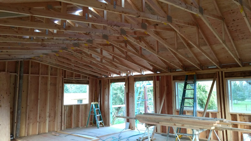 Plywood has been added above the roof trusses.