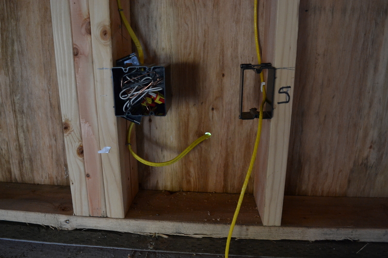 garage inside south; west corner; network jack 4 and wiring to support HVAC probably (going through the wall).