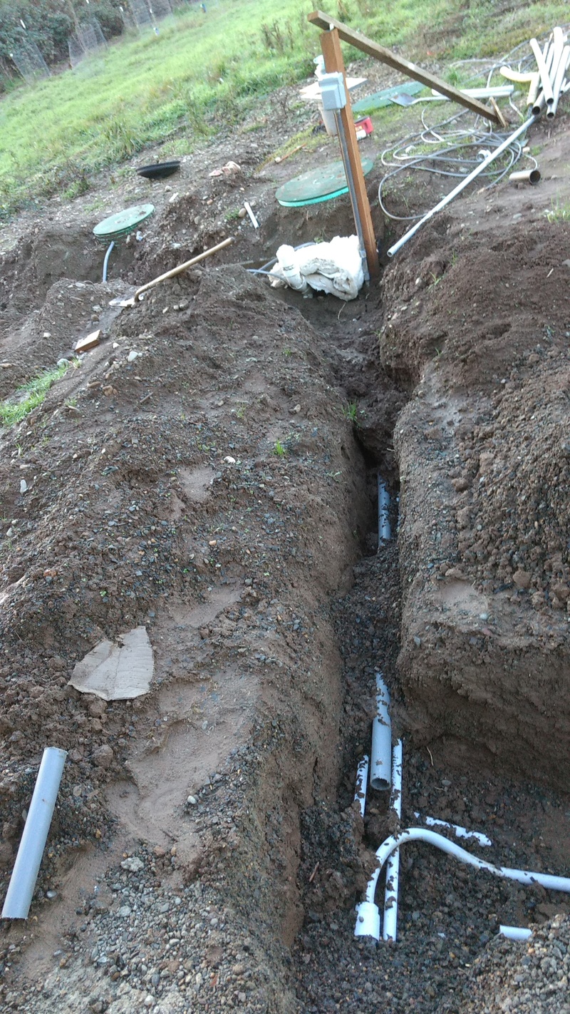 Here is a longer view of the trench from the garage to the septic tanks. Notice the bat of insulation that is protecting the water line from freezing rain.