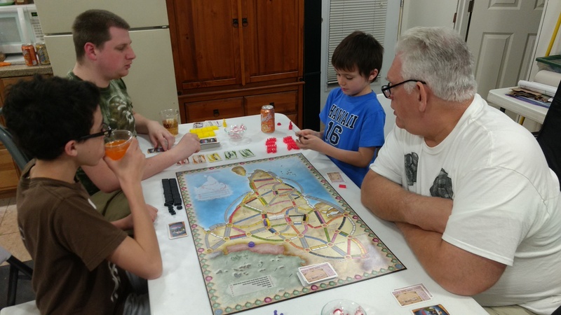 Lois, Mikey, Isaac, Kili, Don, playing Ticket To Ride, India edition