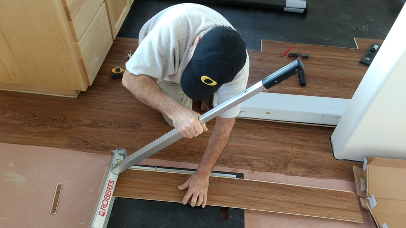 Laminate flooring being installed.