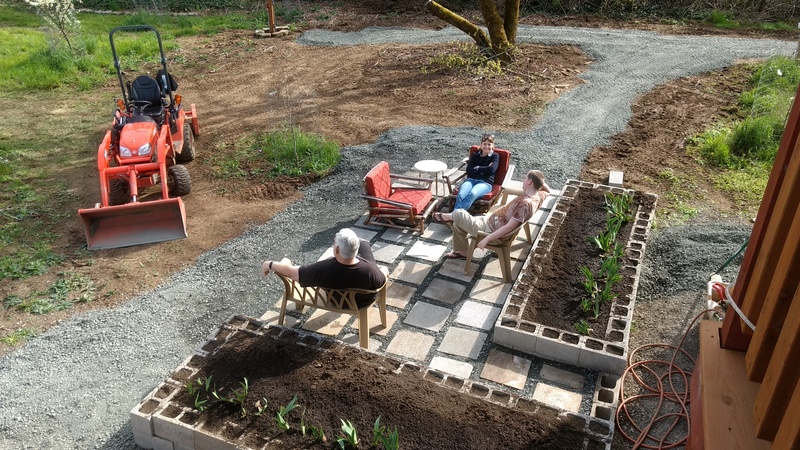 Don, Rachel Anderson, and Isaac enjoying the new Greenhouse Patio.