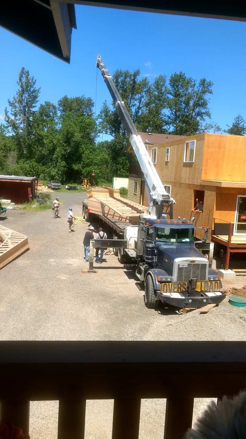 Second load (scissor trusses) has been moved from the truck to the ground.