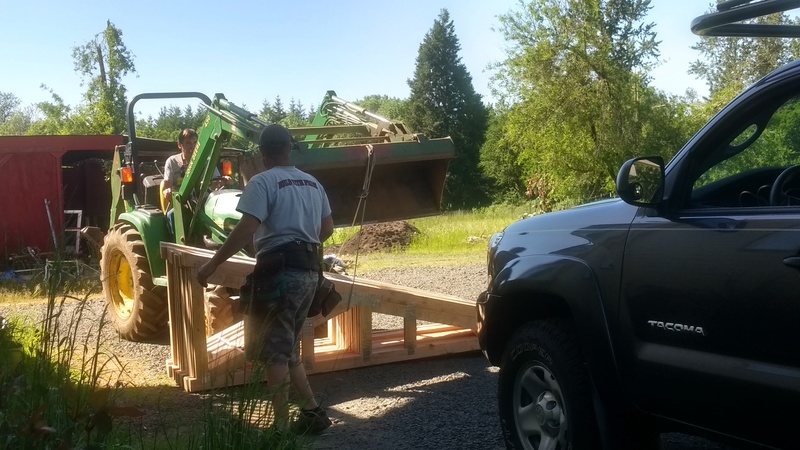 Moving the last trusses, the front porch.