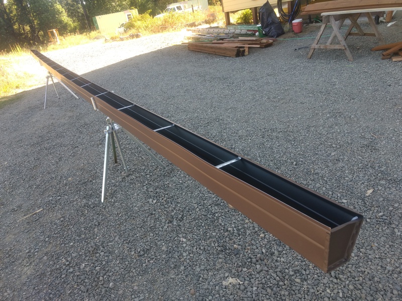 One raingutter, fabricated, ready to hang. Notice the spacers every two feet.