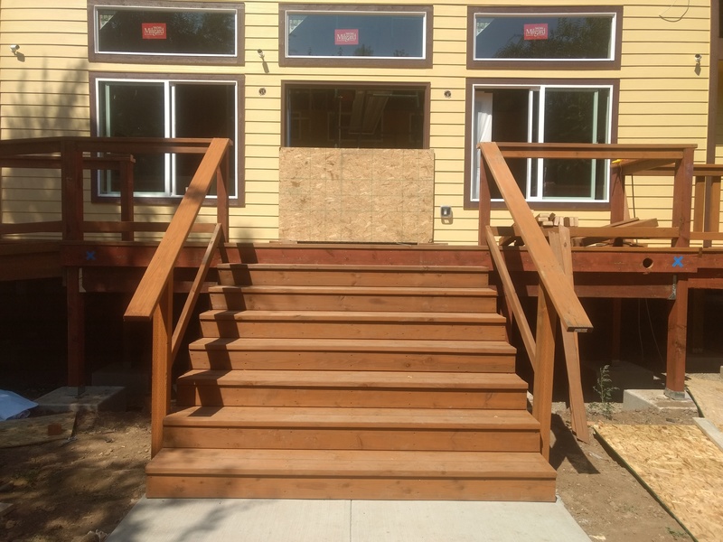 South steps. All treads and risers are in place. Railings are in place but not spindles.