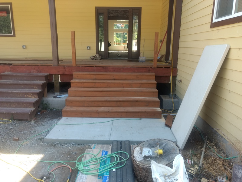 North (front) entry. Stringers, treads, and risers are in place. Two pieces of the railings are in place.