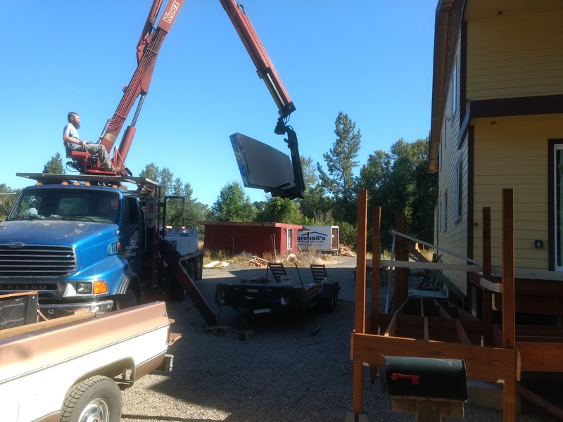 Loading the sheetrock for the second floor.