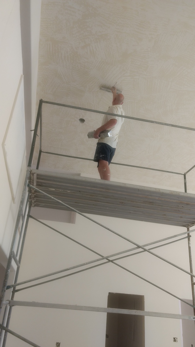 Kevin doing skip-trowel on the great room ceiling.