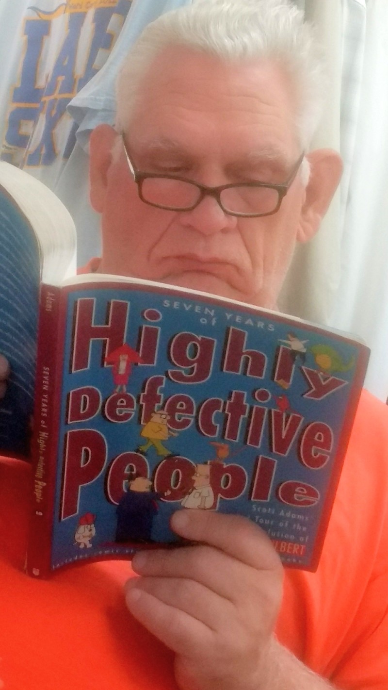 Don reads a Dilbert book, Seven Years of Highly Defective People
