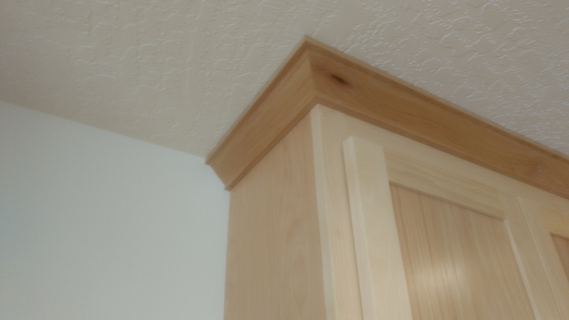 Crown moulding around the tops of the kitchen cabinets. rmk