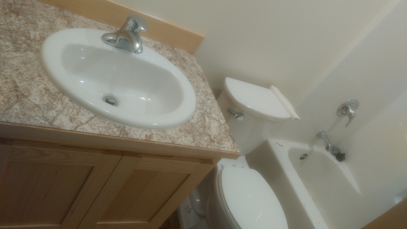 Newly installed bathroom sink and toilet.
