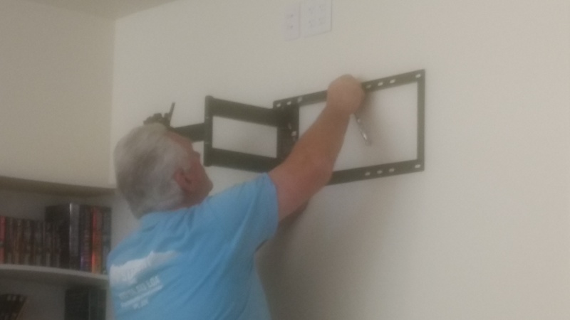 Don installs a TV mounting bracket in the Crow's Nest