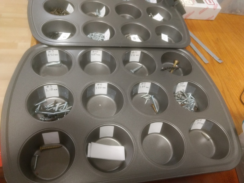 Muffin tin with labels to help Don sort his collection of leftover screws.