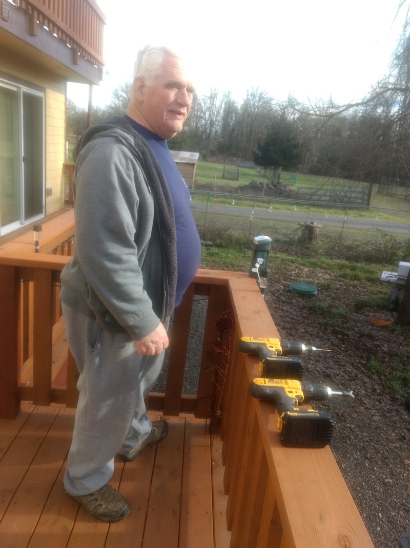 Playing "hooky". Don prepares to install screw hooks on the south deck.