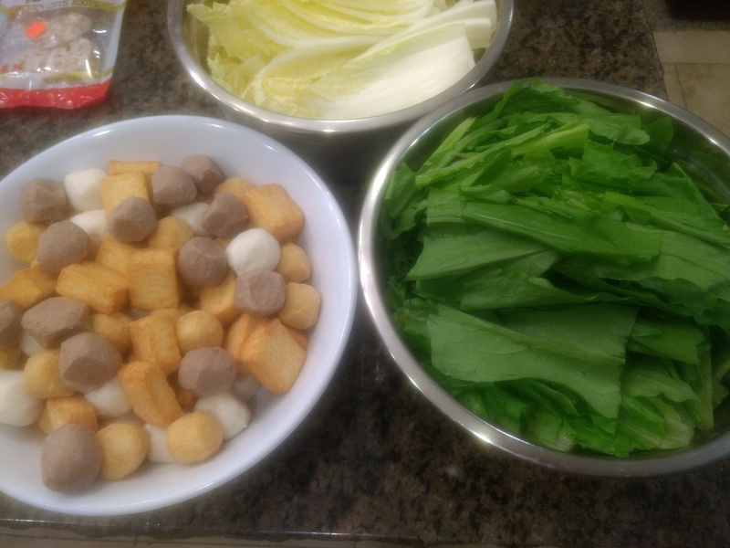 Fish balls, beef balls, fish cakes, and tofu. Greens for hot pot.