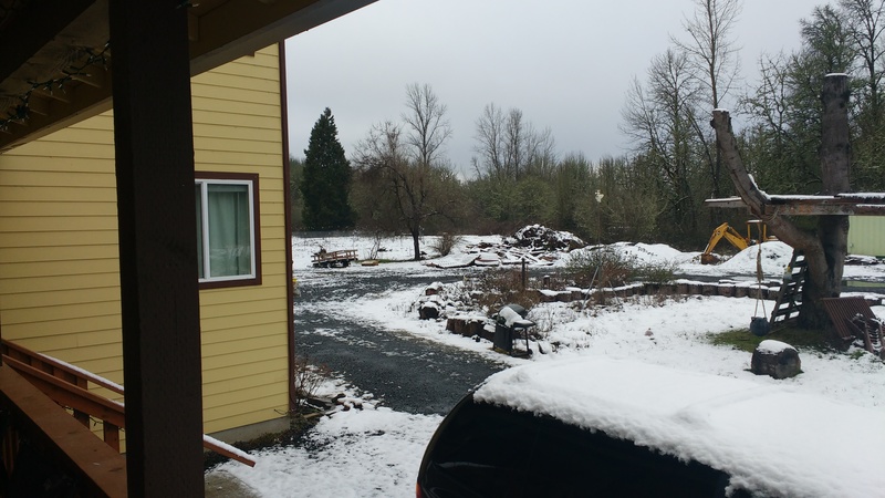 Isaac shows the snow accumulation at Rosewold. Looking northwest from the front porch deck.