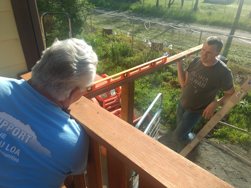 Don and Joseph make sure the gate top is level.