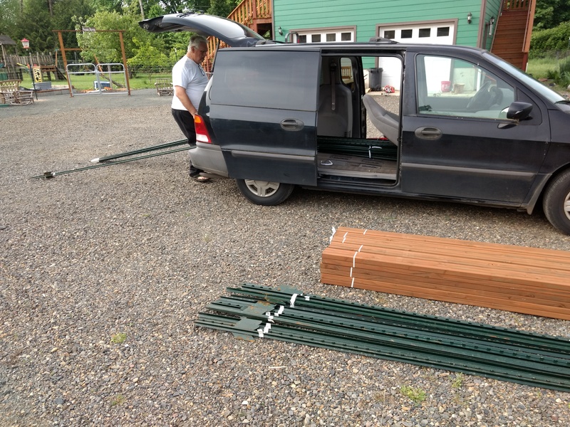 Don unloads T-Posts for the Waffle Pergola