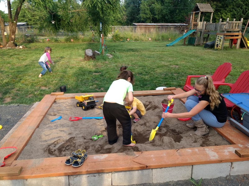 Grandkids playing in the sandbox.