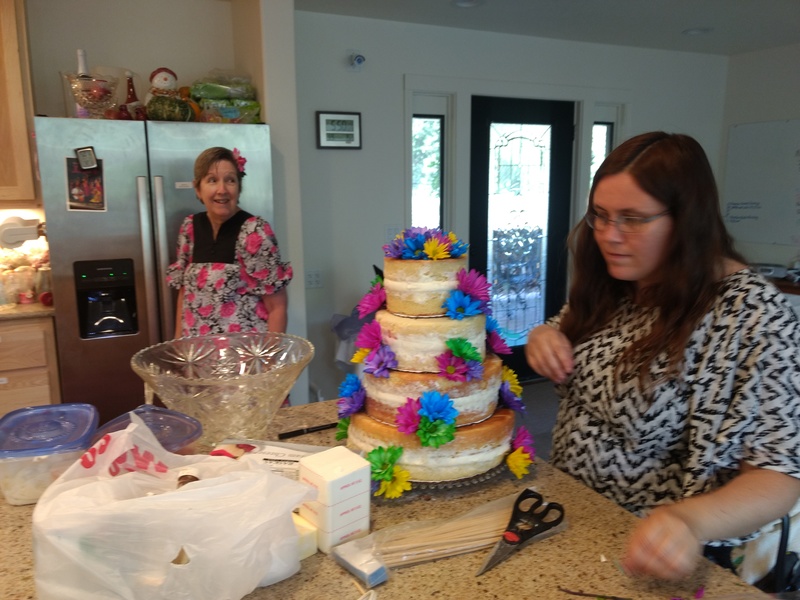 Dina finishing the cake.