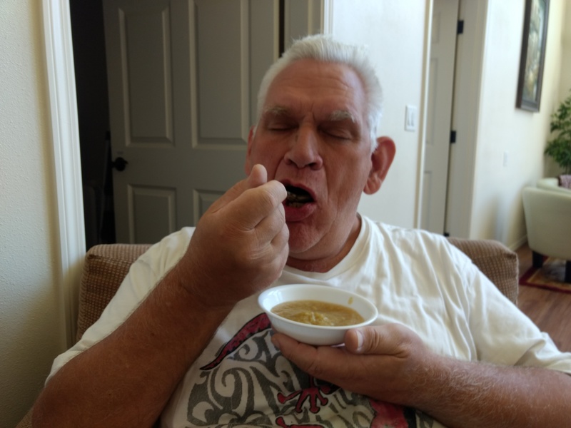 Don enjoys a bowl of tart applesauce.