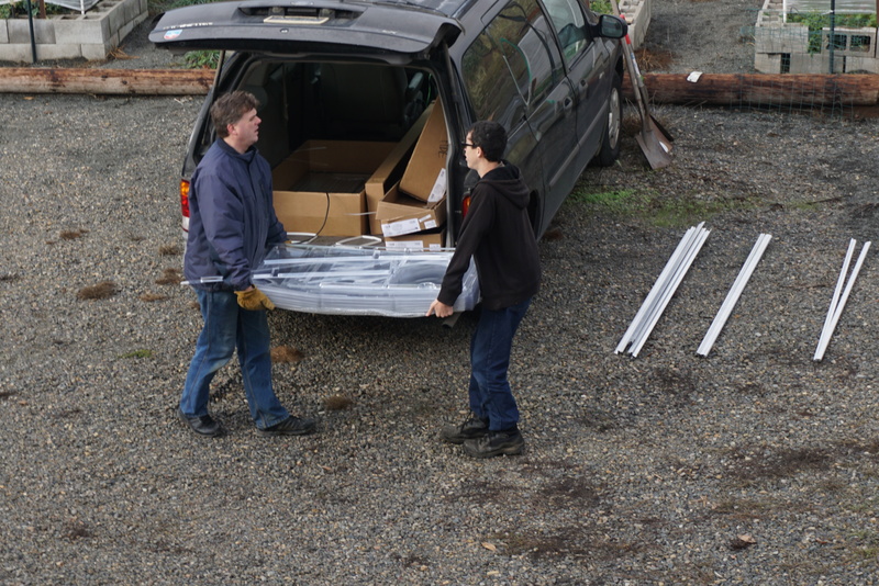 Joseph and Mikey move the panels to the construction area.