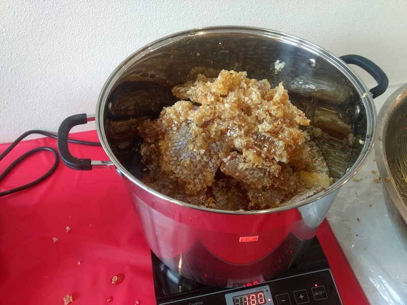 Melting the honeycomb at 180F. Pot #2.