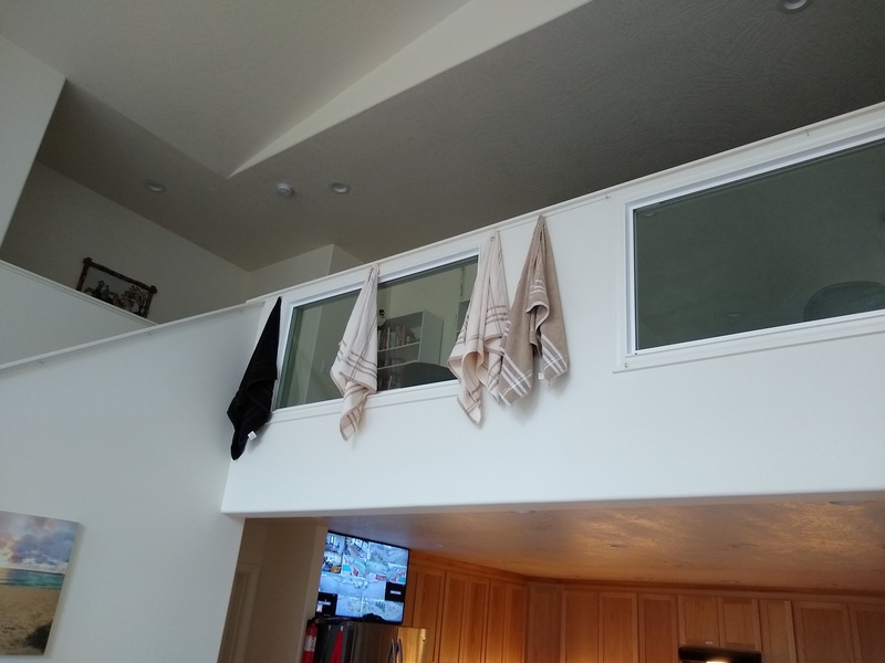 Bath Towels hanging artfully from the hooks on the Crow's Nest railing.