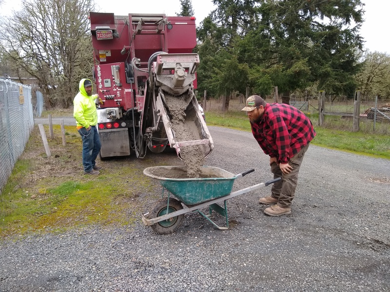 Mini-Mix provided the small load of concrete. Our contractor Ken is in the red plaid shirt.