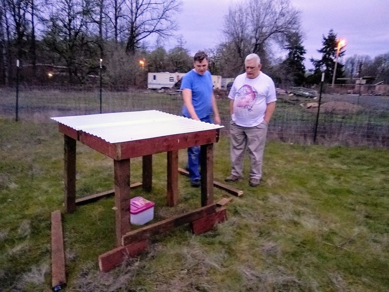 Joseph shows Don his construction efforts for the sheep shelter.