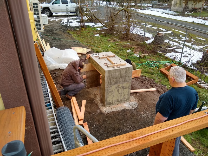 Fri: Don watches as the concrete workers remove the wooden forms.
