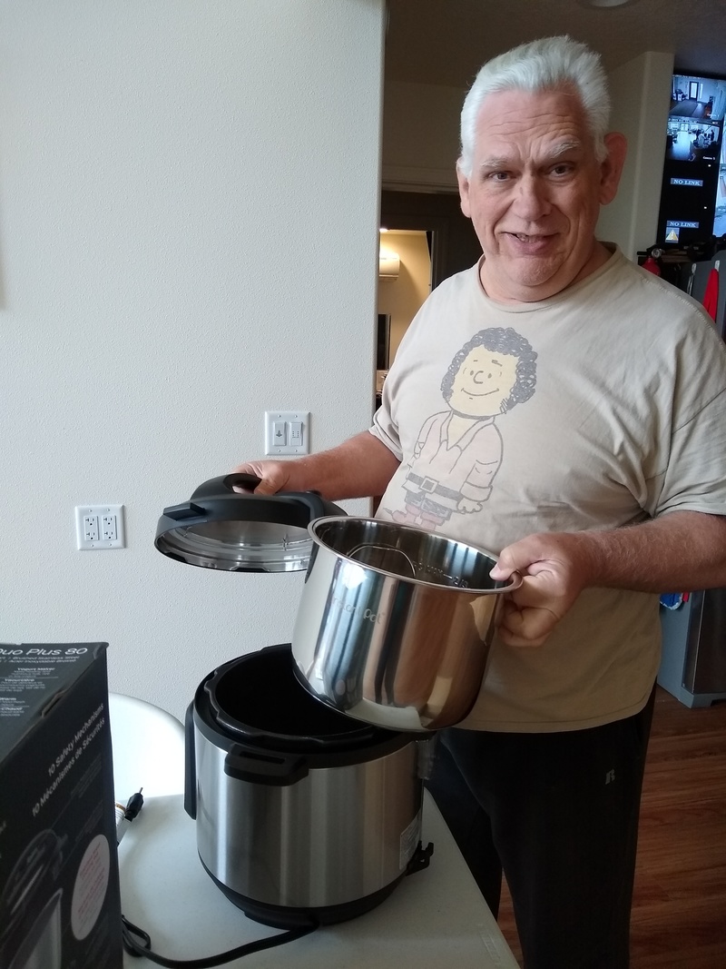 Don examines the gigantic new Instant Pot that Lois got from Amazon.