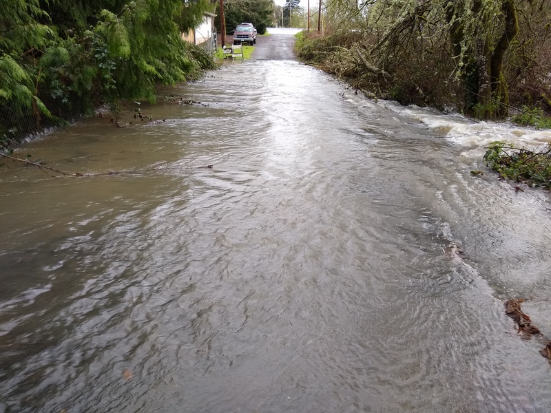 Mon 18:07 Water is crossing Rosewold Lane. Culvert Gully is about 30%