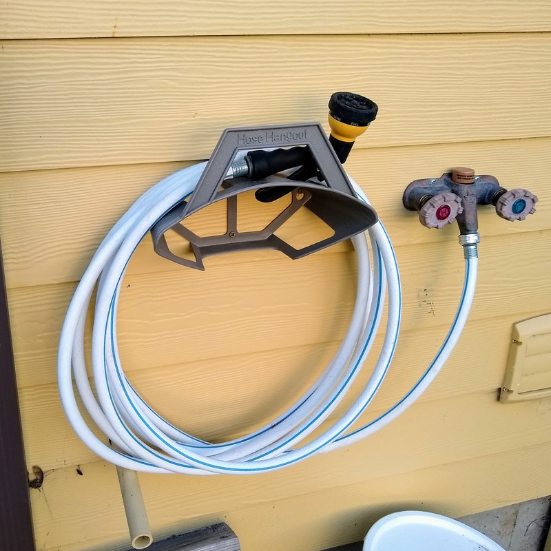 New Hose Hanger next to our special outdoor hot/cold faucet.