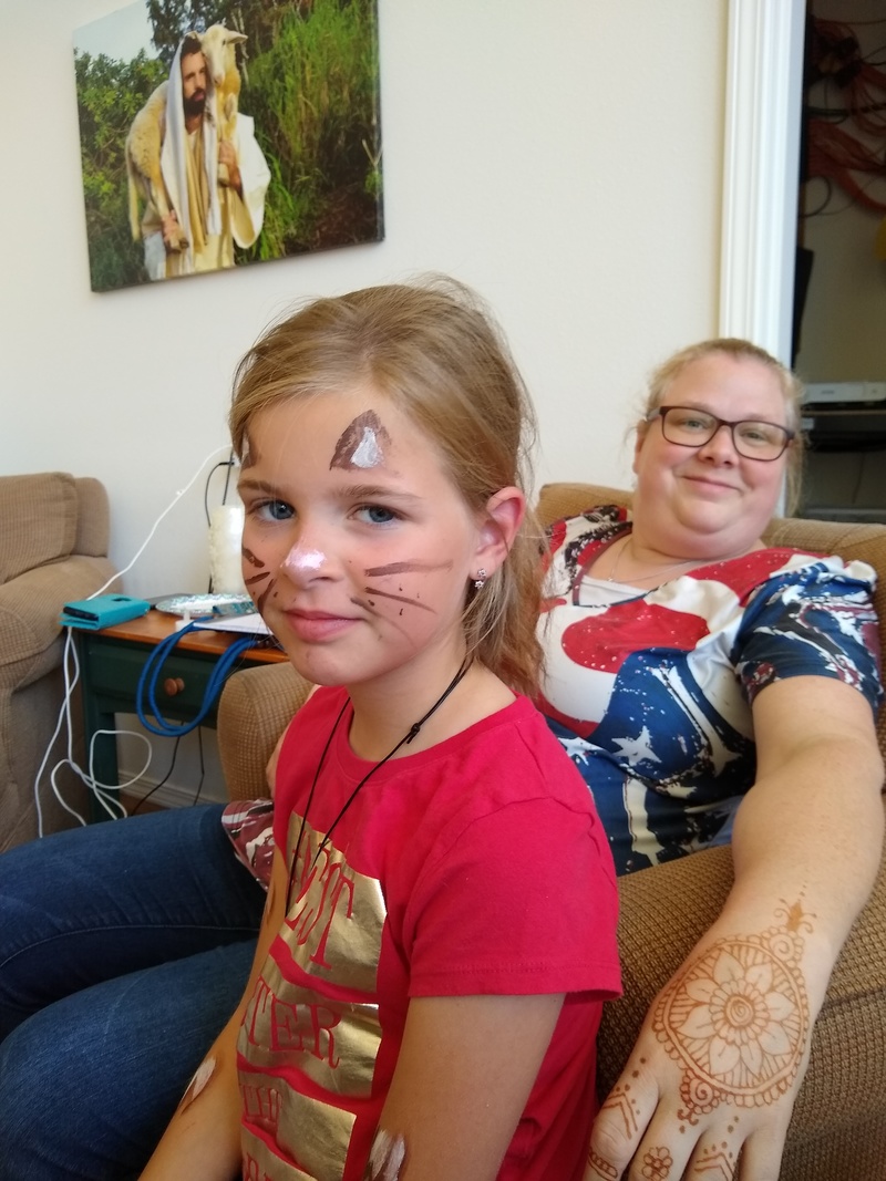 Cassie the Cat, and Lucky Lady Larissa with a henna artwork that Tia did.