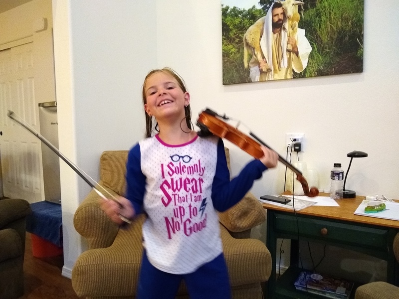 Cassi is excited to play the violin for us.