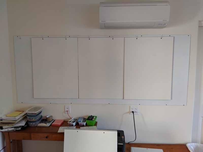 Don put up hooks above the whiteboard so smaller items (in this case smaller whiteboards) could hang in front.
