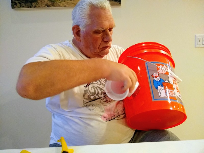 Inserting the elbow into the bucket.