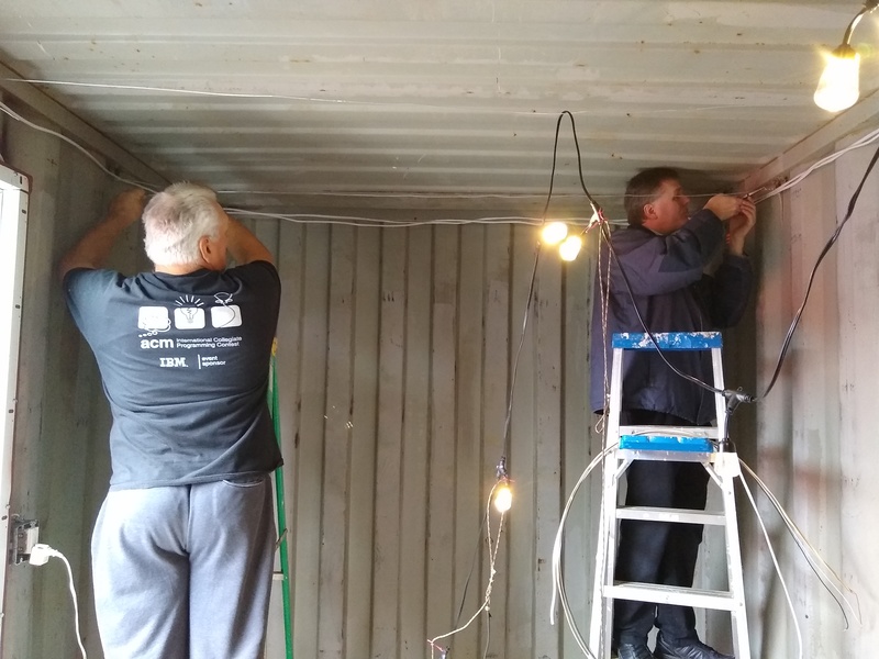 Don and Joseph hanging wire for lights.