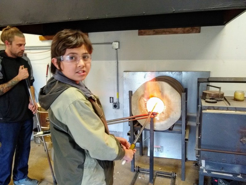 Melting the glass to be able to blue it bigger.