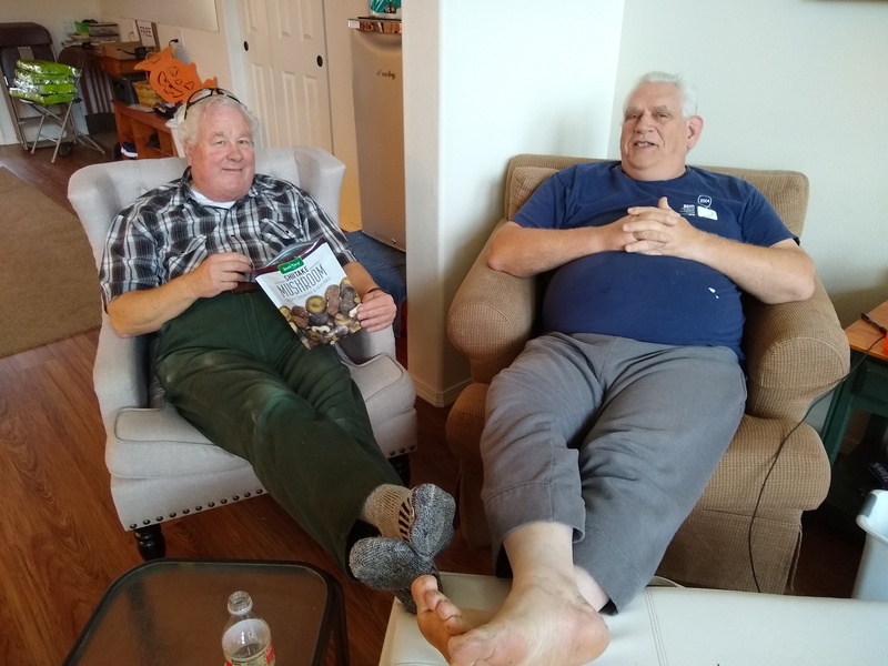 Two guys relaxing after working hard.